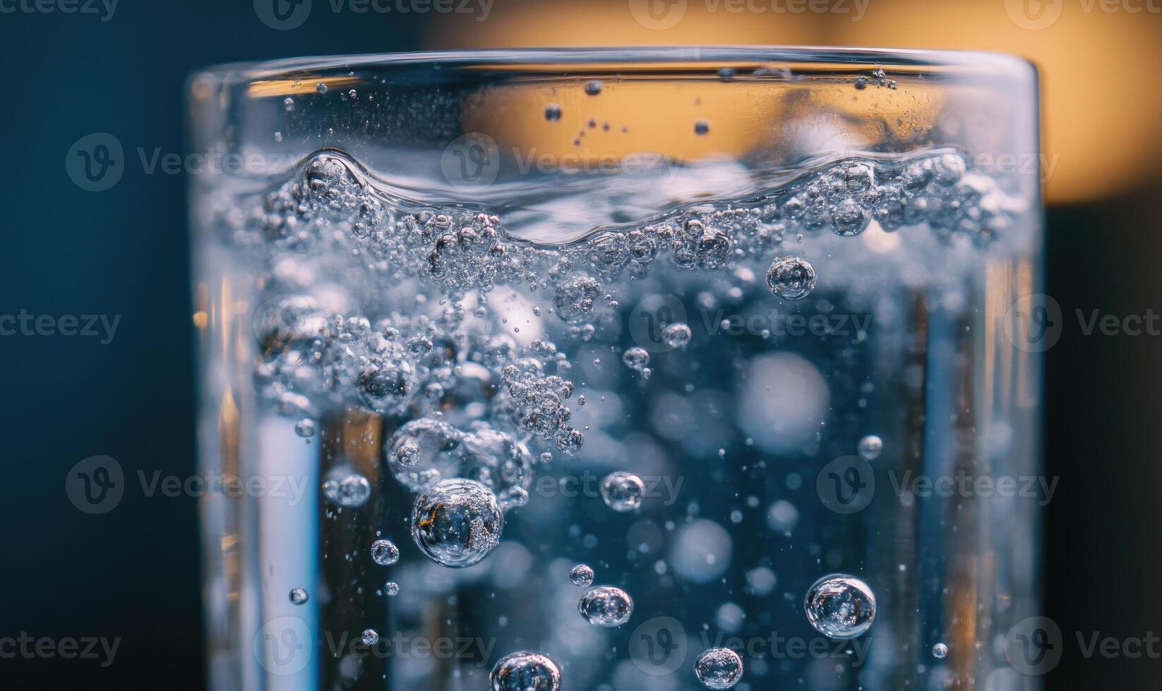 Tablet fizzing in water, bubbles ascending, close-up shot photo