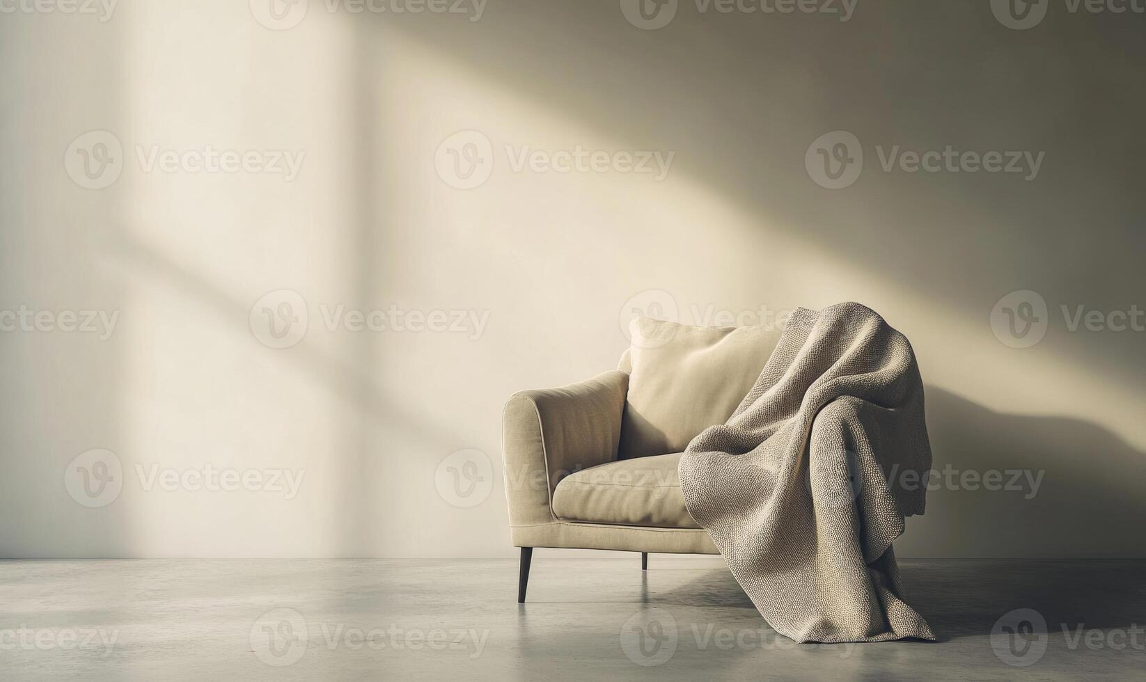 A white couch with a blanket draped over it sits in a room with a window photo