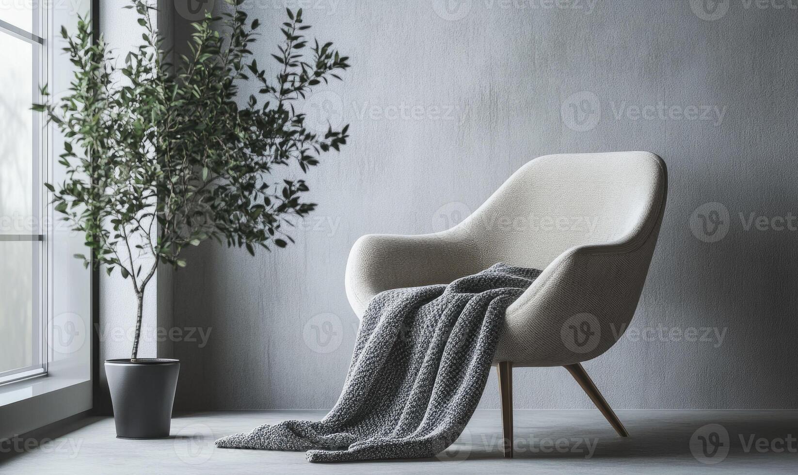 A white chair with a blanket draped over it sits in front of a window photo