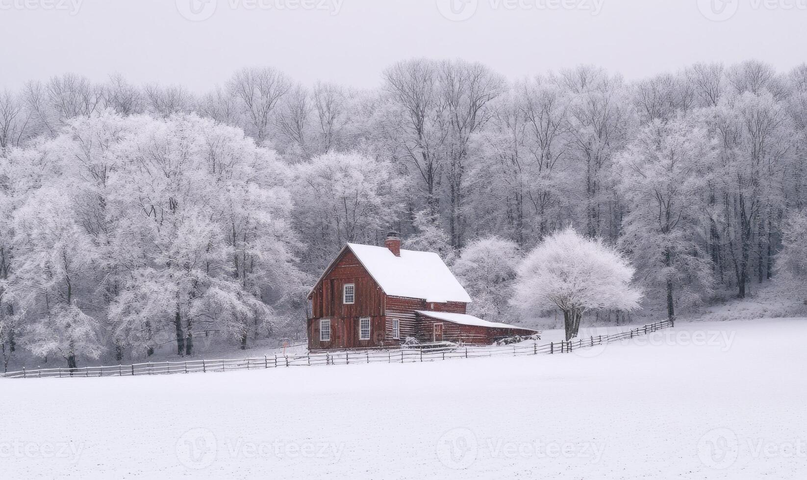 A small red house sits in a snowy field photo