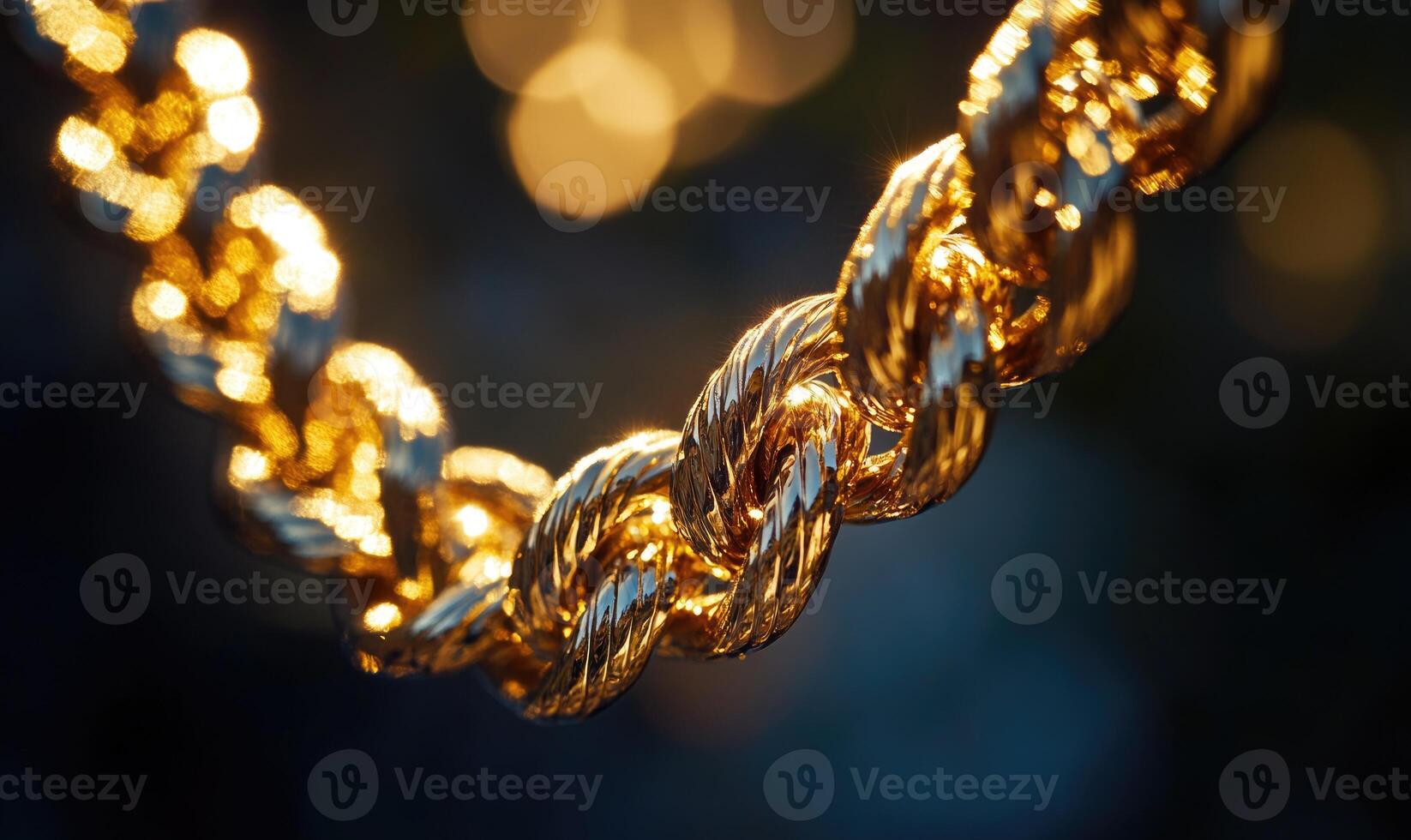 A gold chain with a knot in the middle photo