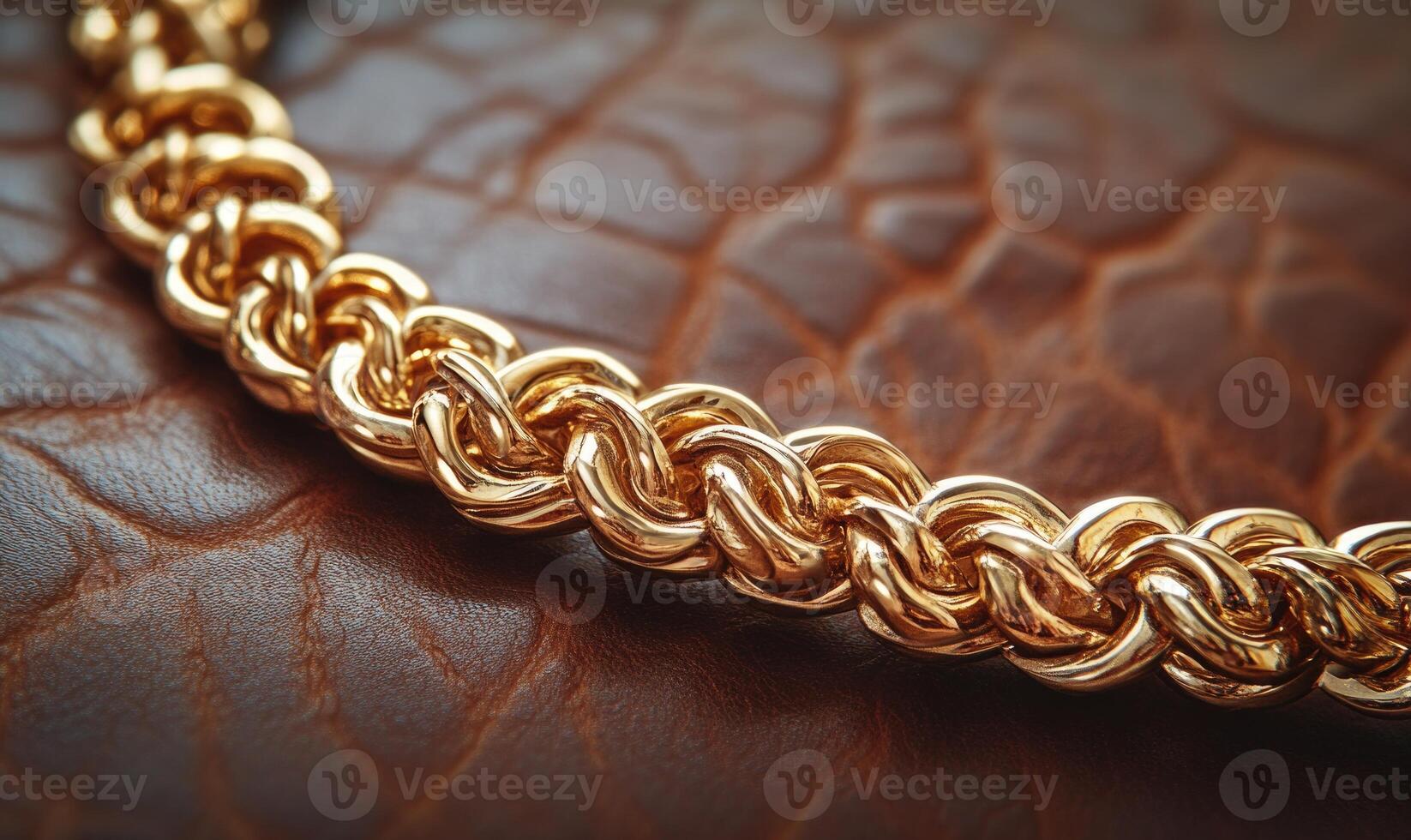 A gold chain with a gold clasp is on a brown surface photo