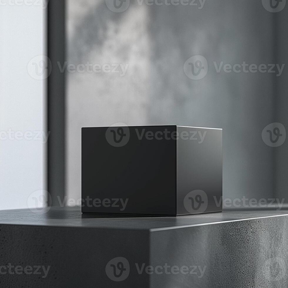A black cube sitting on a table in front of a window photo