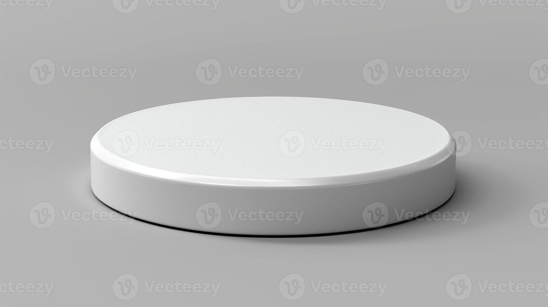 A white round object on a gray surface photo