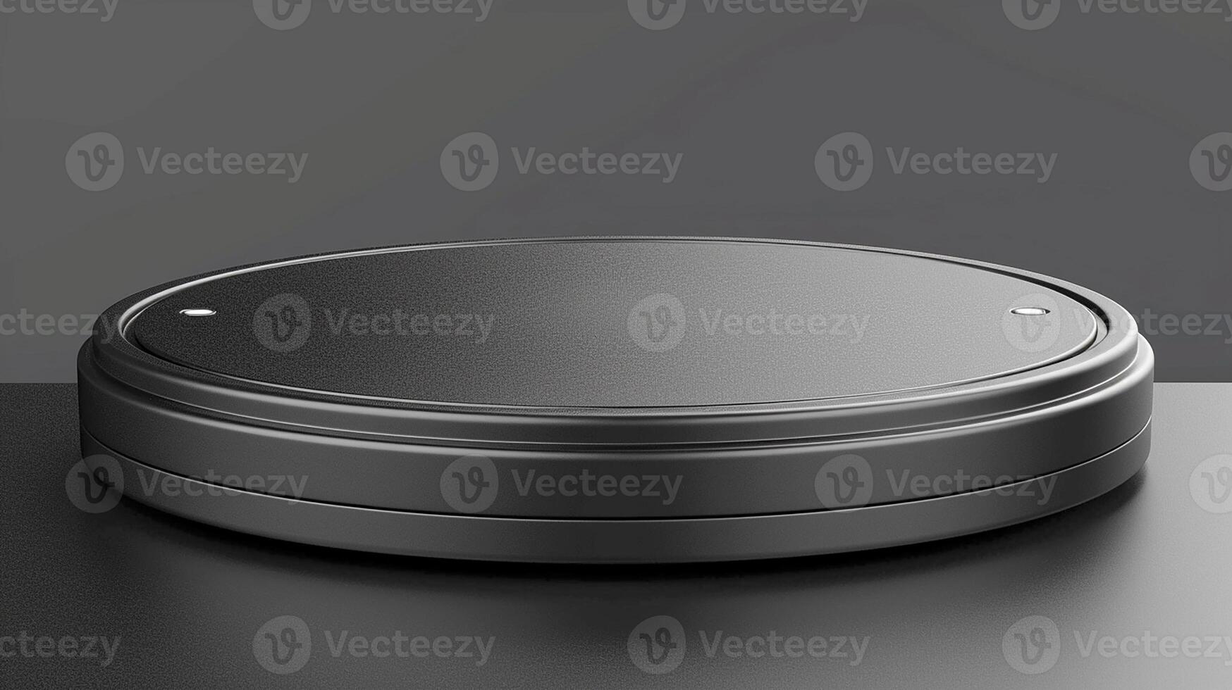 A black circular object on top of a table photo