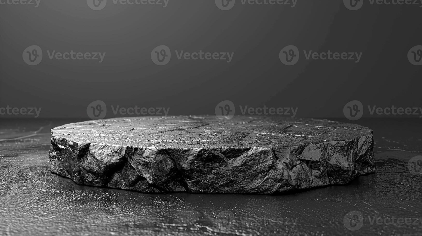 A black stone table with a black background photo