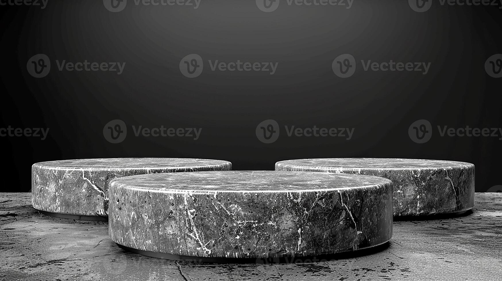 Three marble round tables on a concrete floor photo