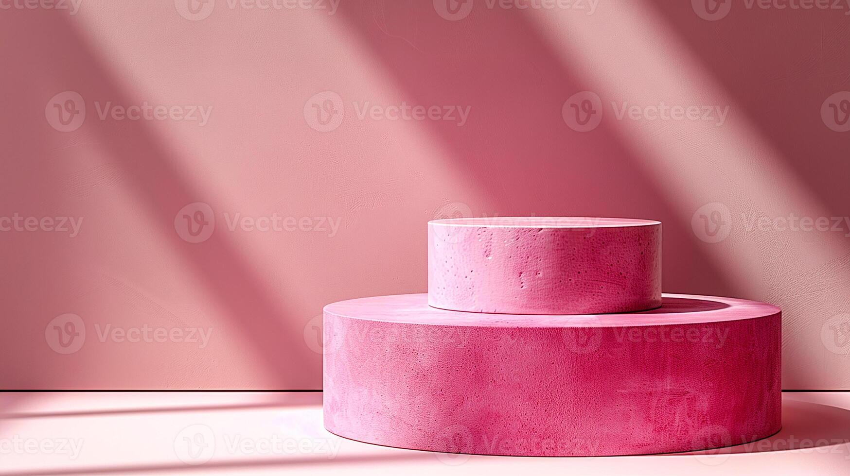 A pink cake sitting on a table in front of a wall photo
