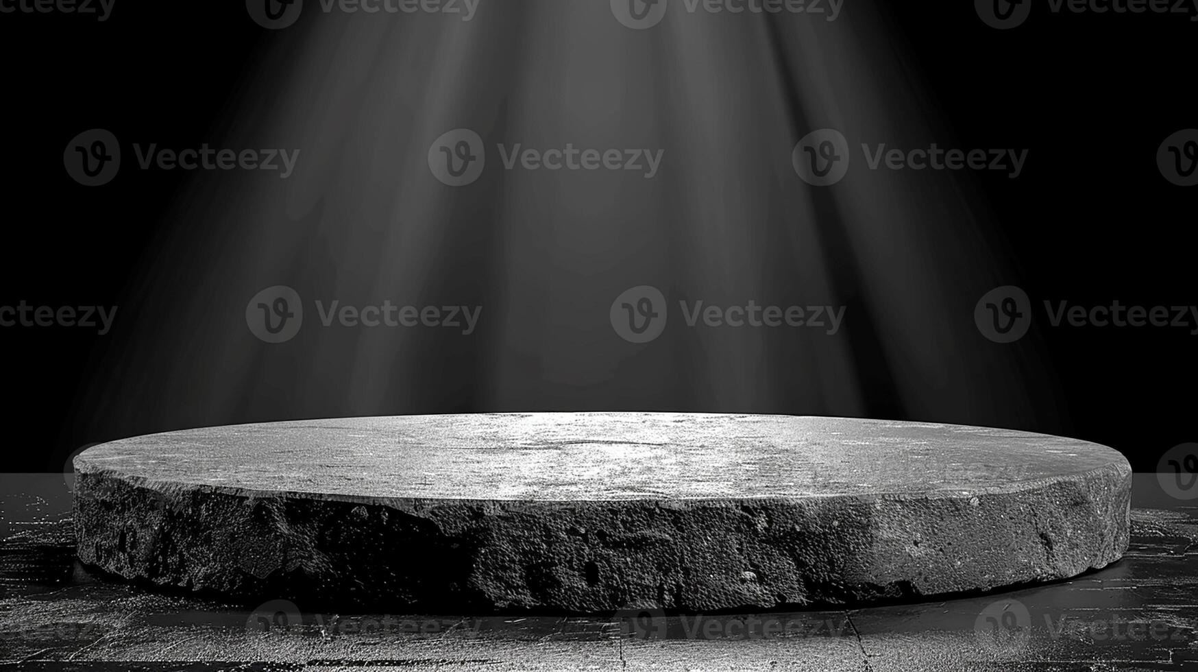 Black and white photo of a stone pedestal with light shining from above