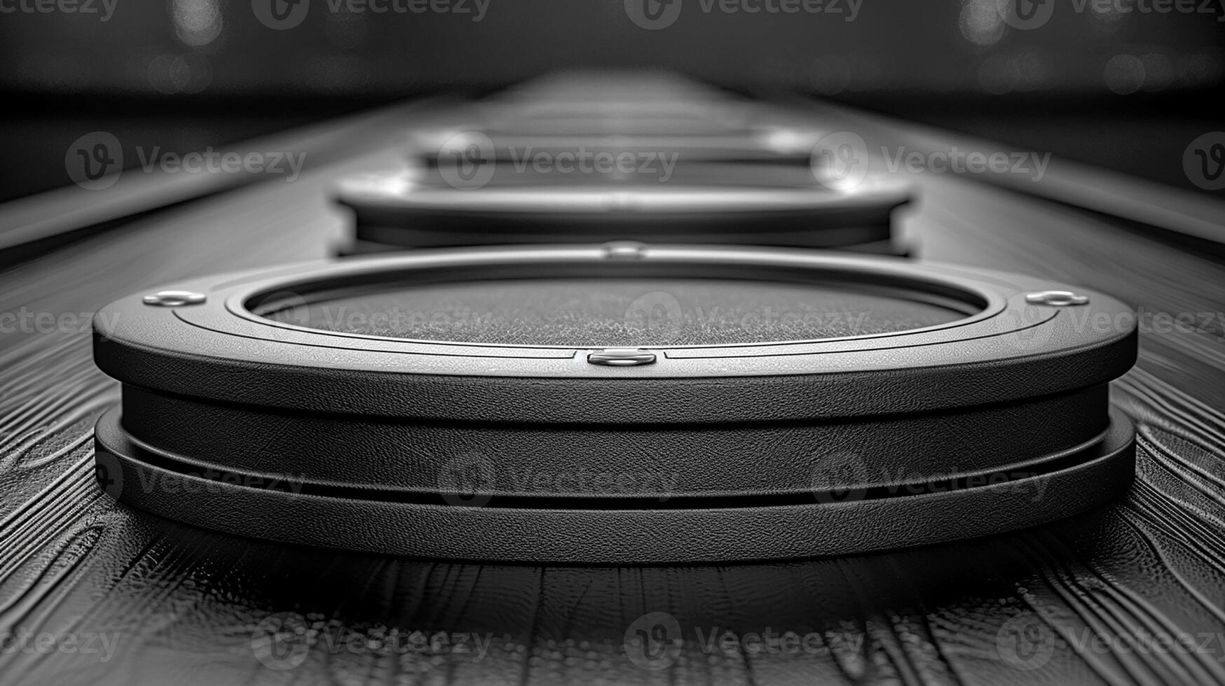 A black and white photo of a row of speakers