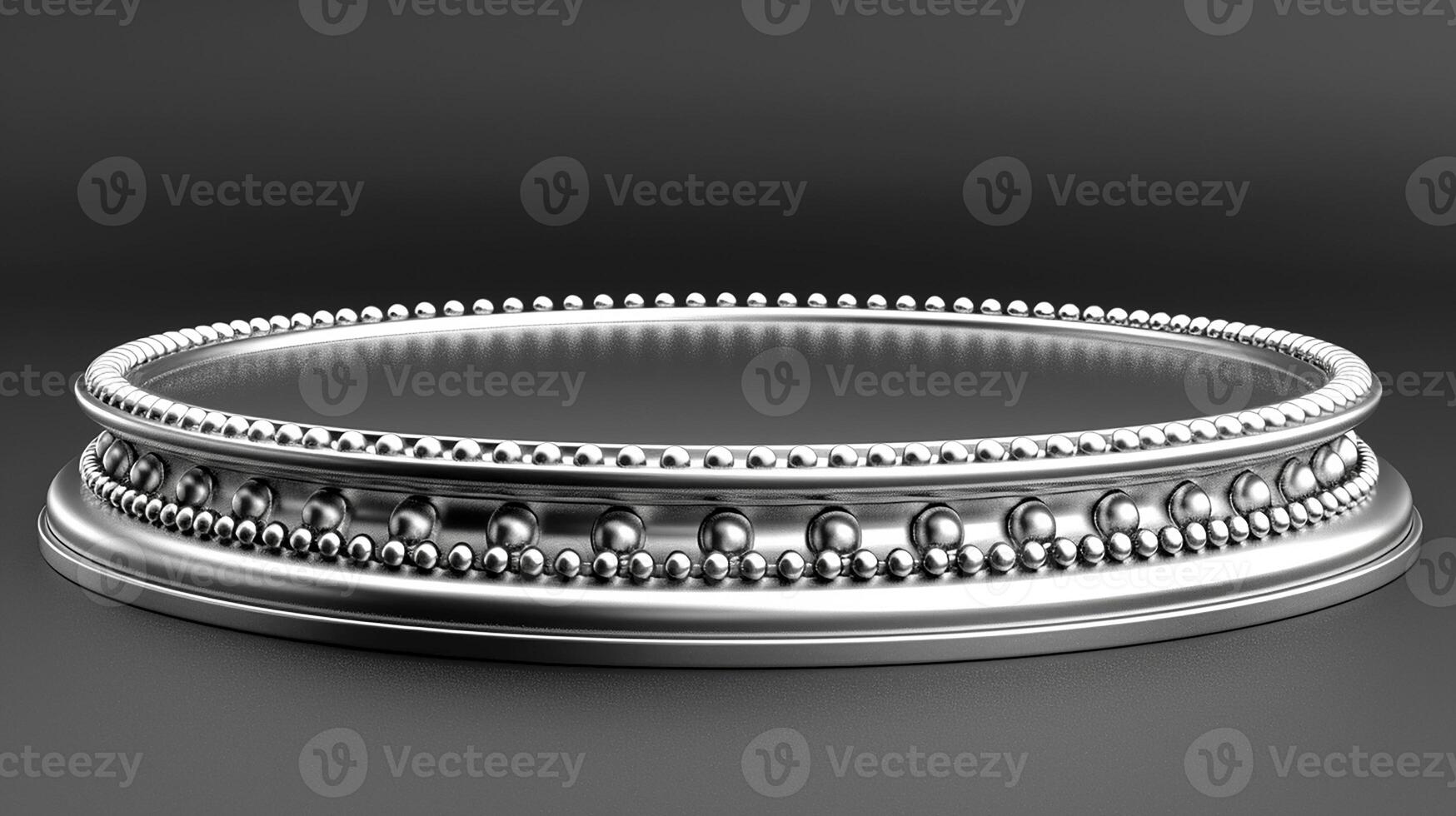 A silver ring on a black surface photo