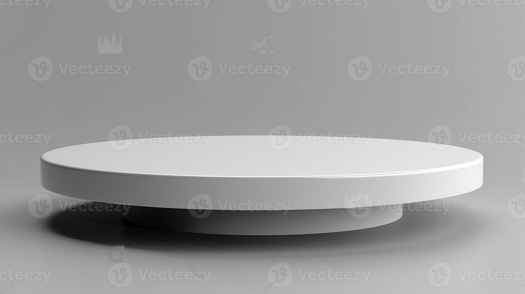 A white round table on a gray background photo