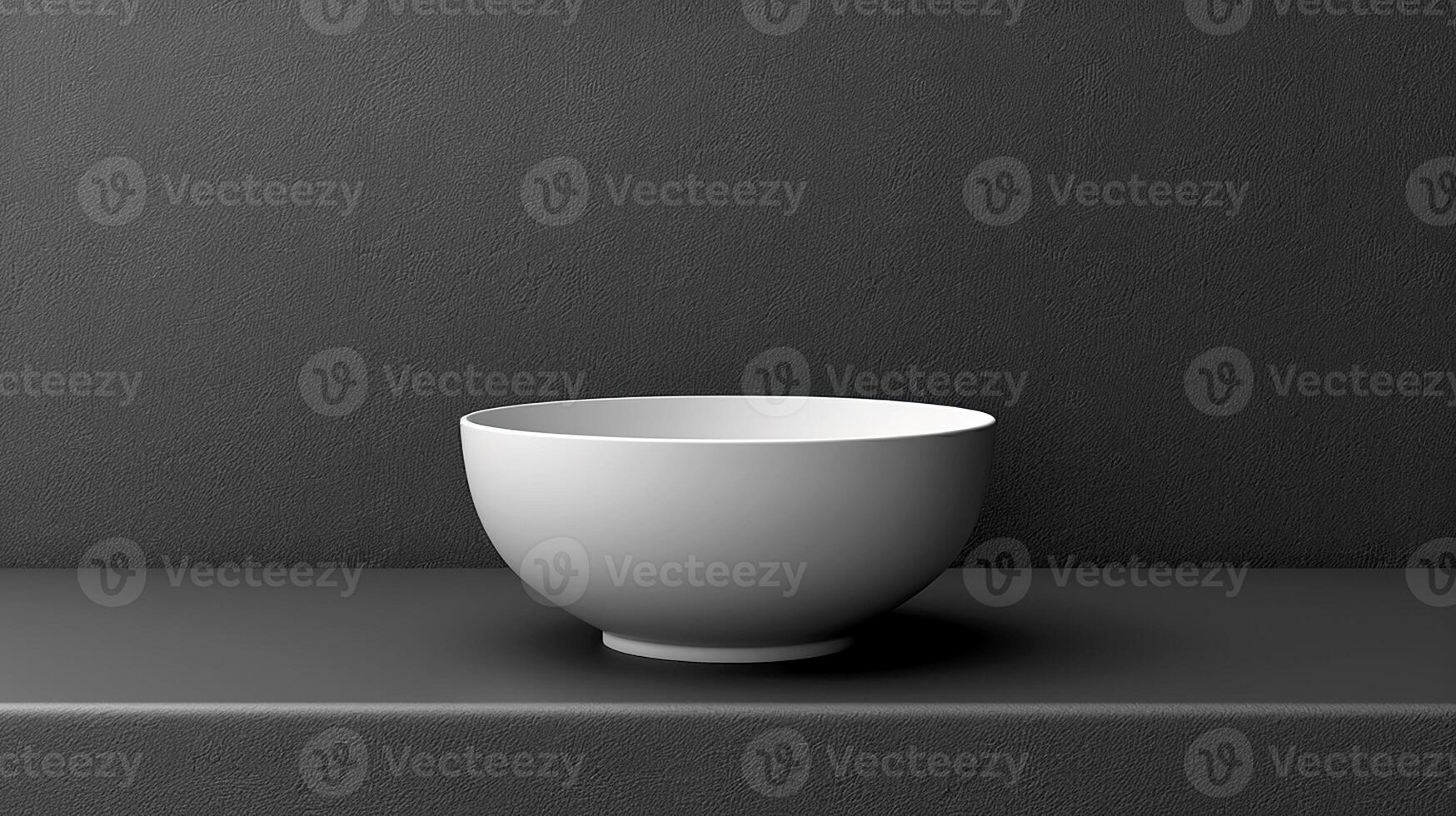 A white bowl sitting on a black surface photo