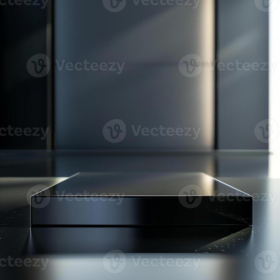 A black box sitting on a table in front of a wall photo