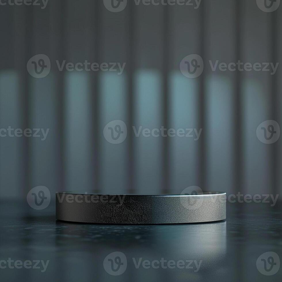 A black object sitting on a table in front of a wall photo