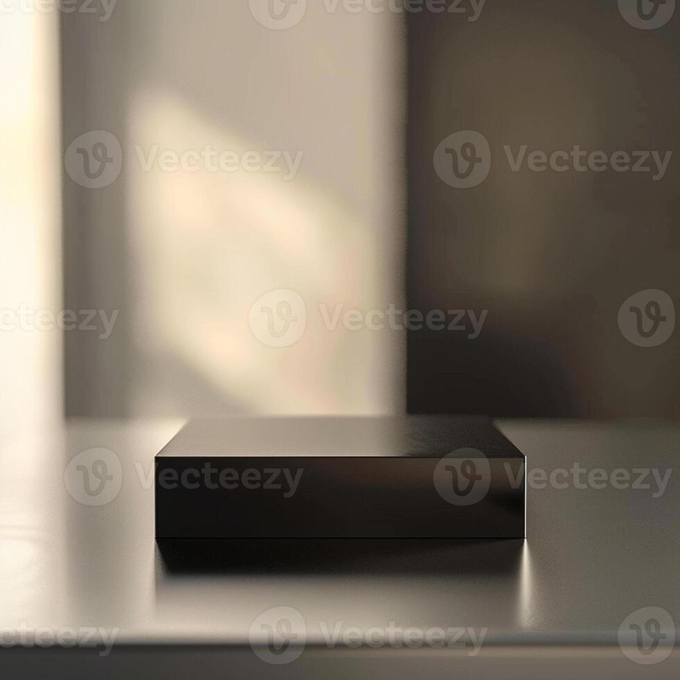 A black box sitting on a table in front of a window photo