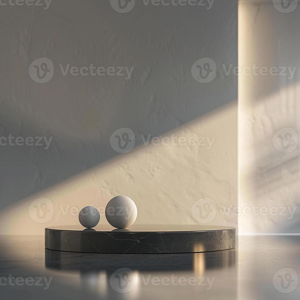 Two balls sit on a table in front of a wall photo