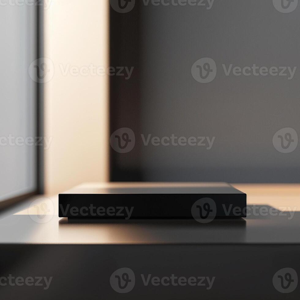 A black box sitting on a table in front of a window photo