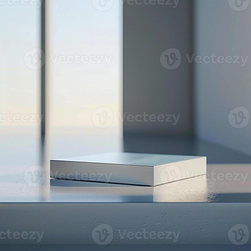 A white box sitting on a table in front of a window photo