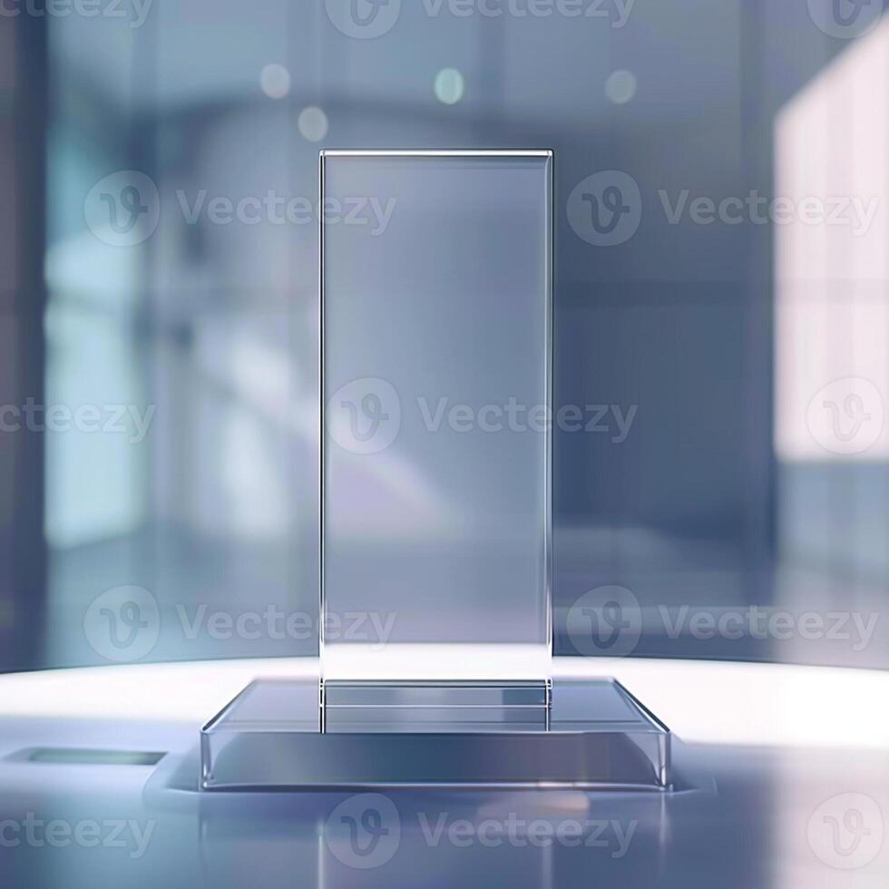 A glass trophy on a table in front of a window photo
