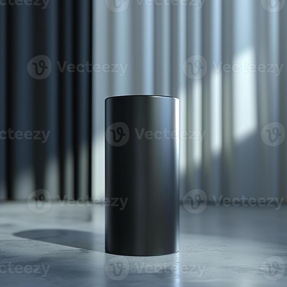 A black cylinder sitting on a floor in front of a window photo
