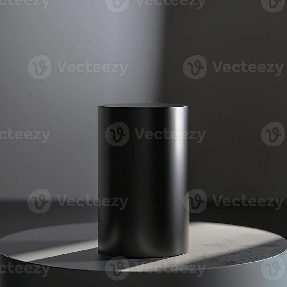 A black cylinder sitting on a table in front of a light photo