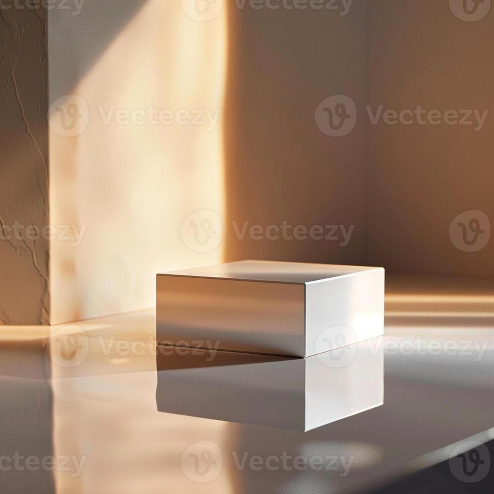 A white box sitting on a table in front of a wall photo