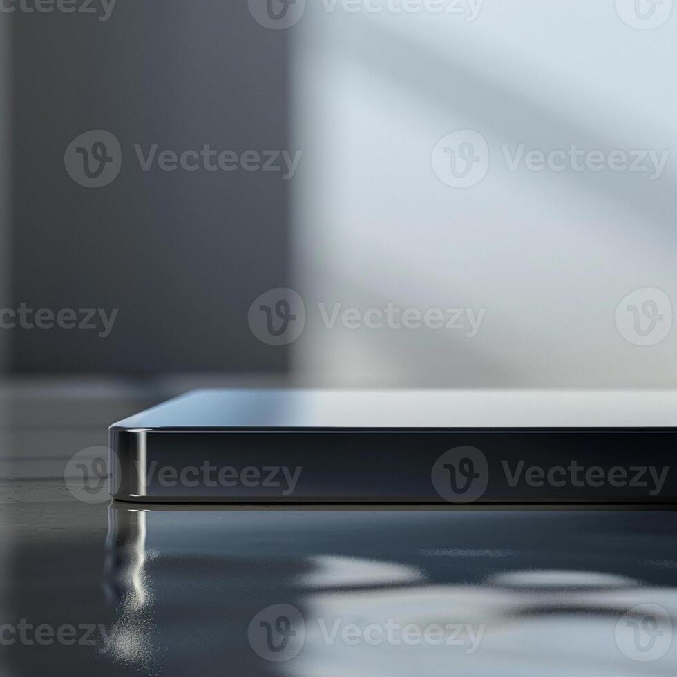 A close up of a black smartphone sitting on a table photo