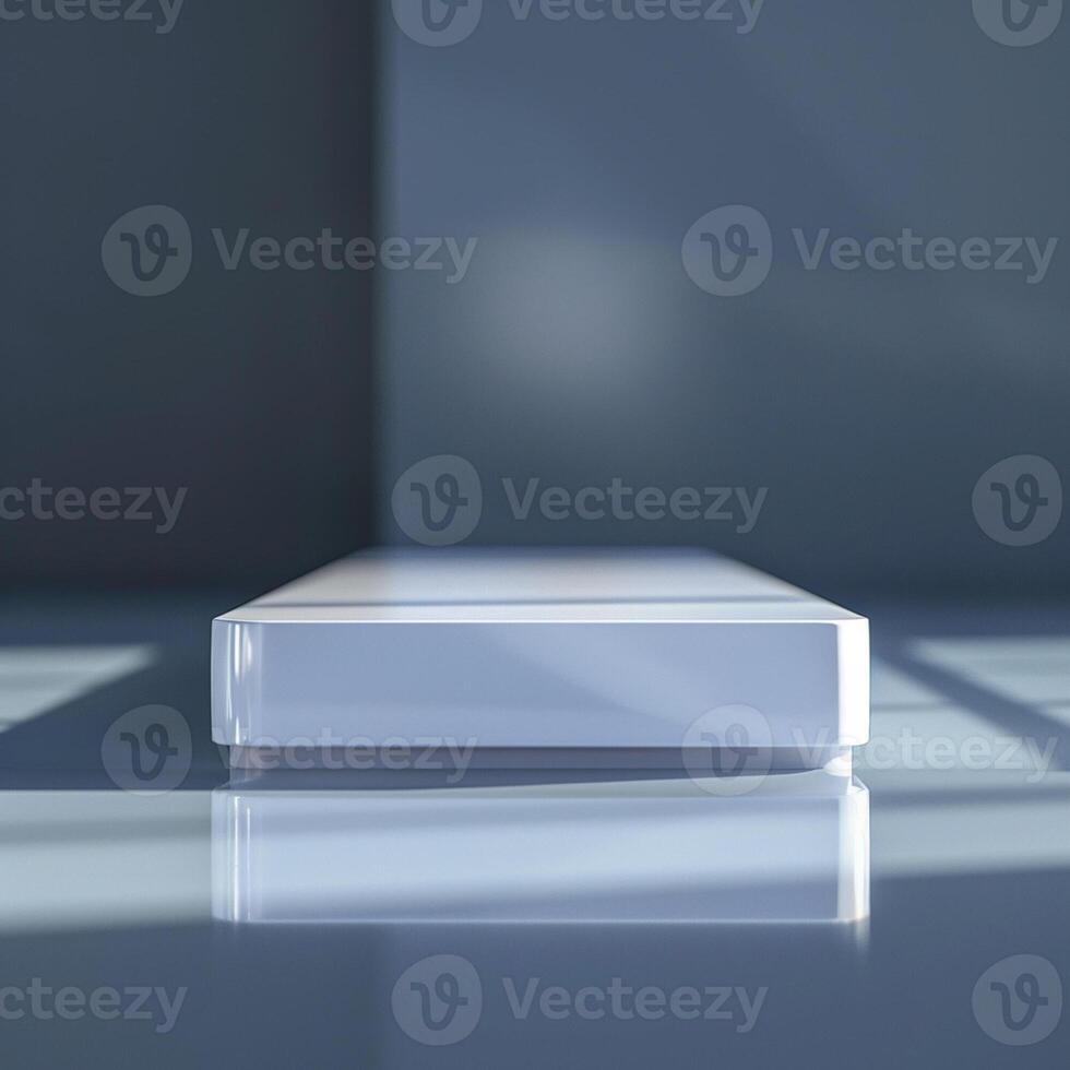 A white box sitting on a table in front of a window photo