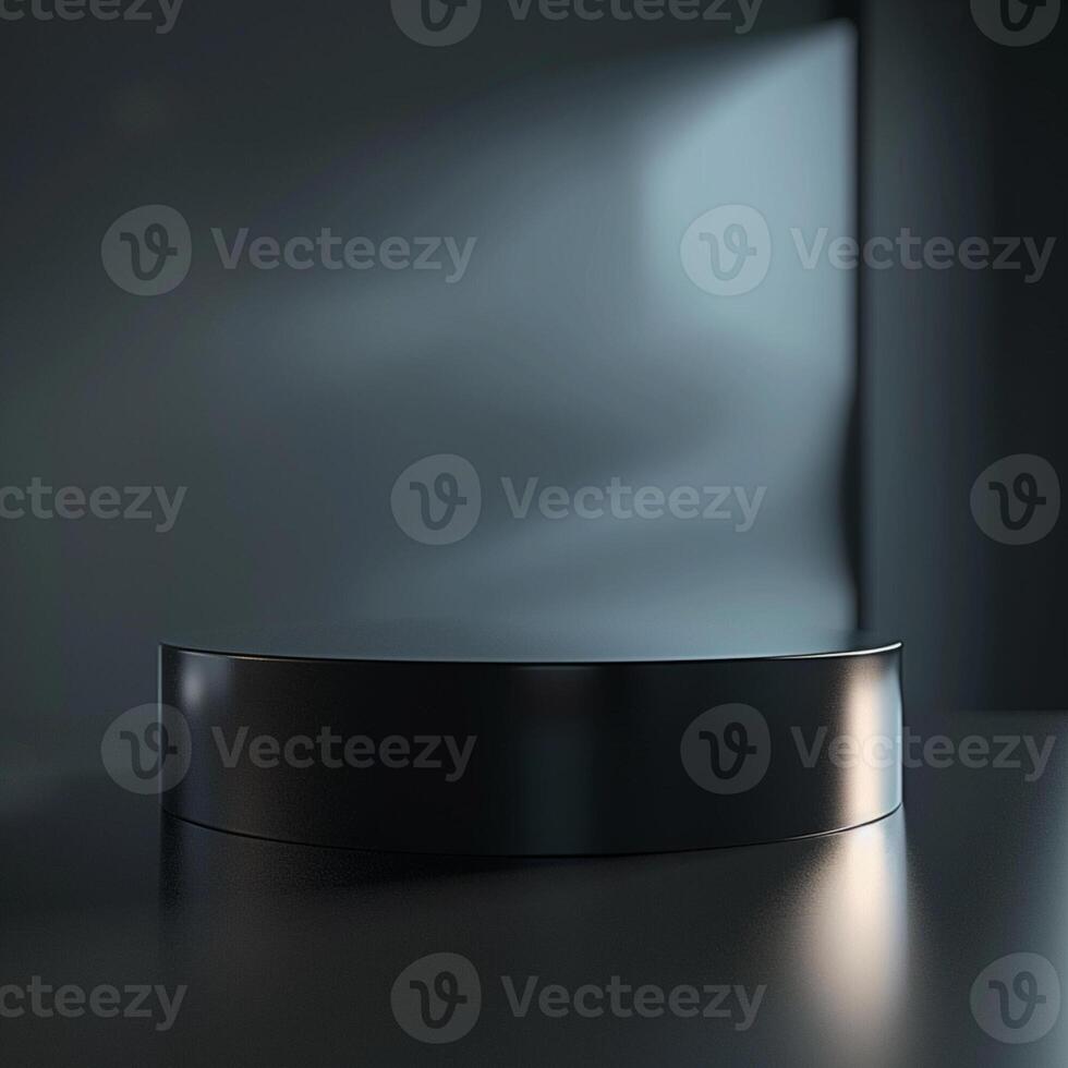 Black round podium on a dark table with a light photo