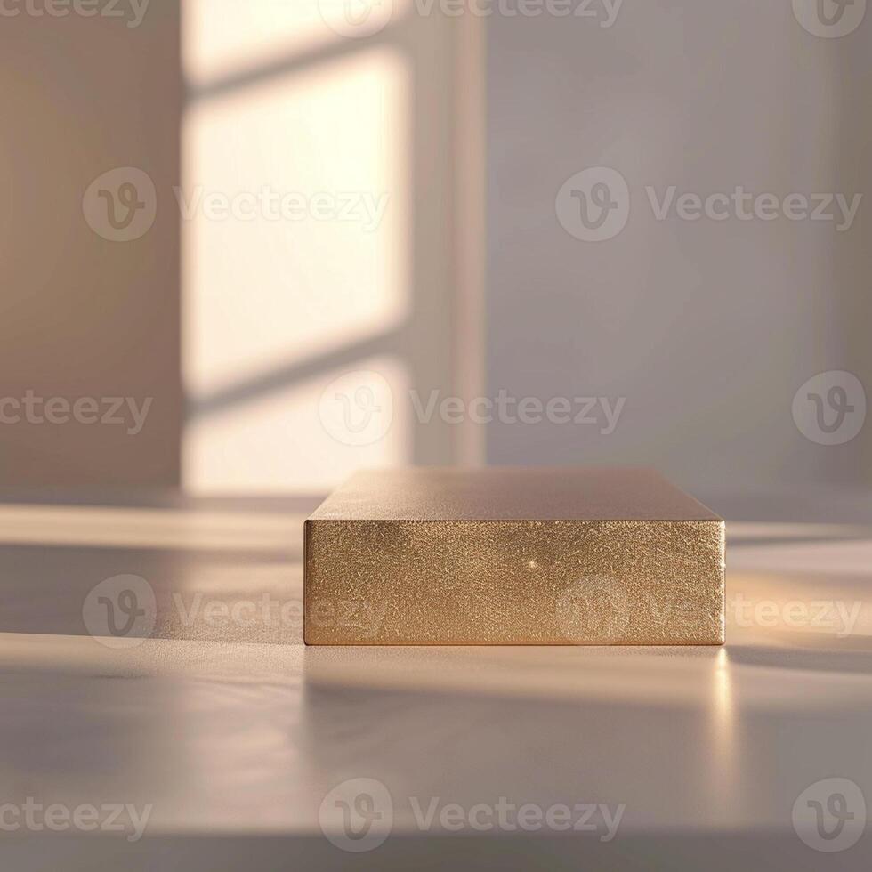 A golden box sitting on a table in front of a window photo