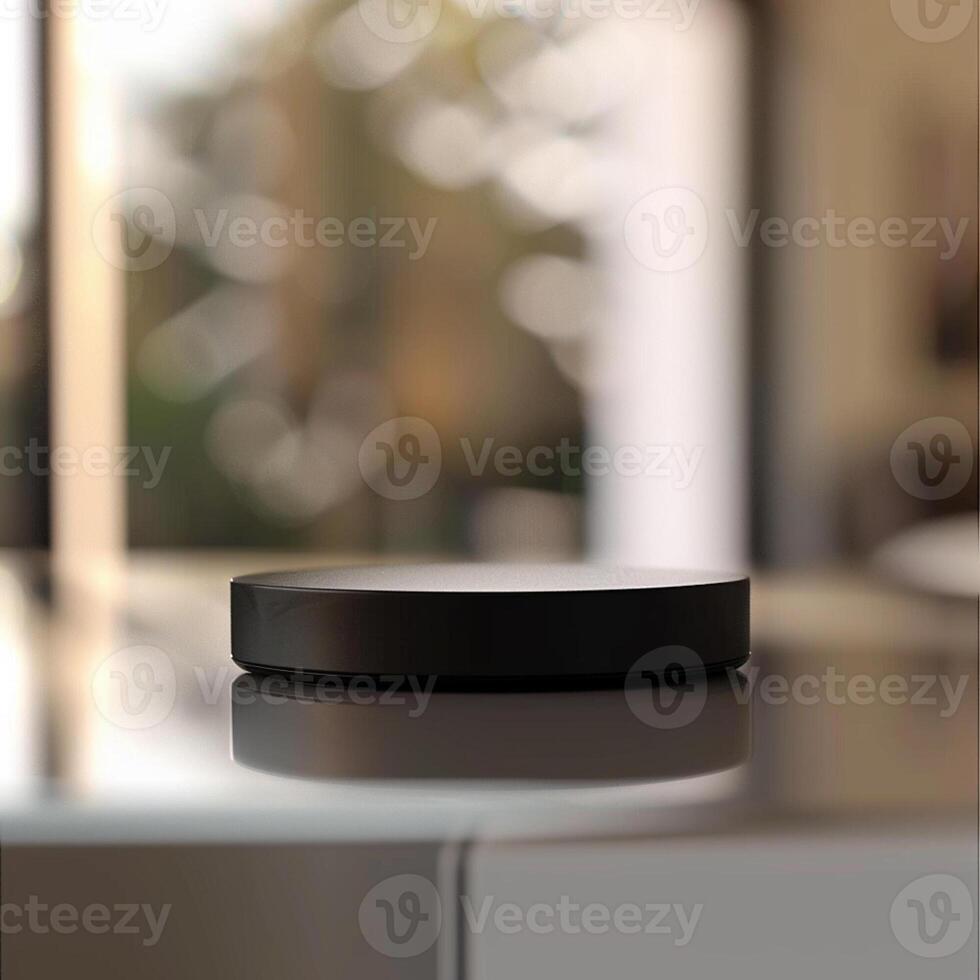 A black circular object sitting on top of a table photo