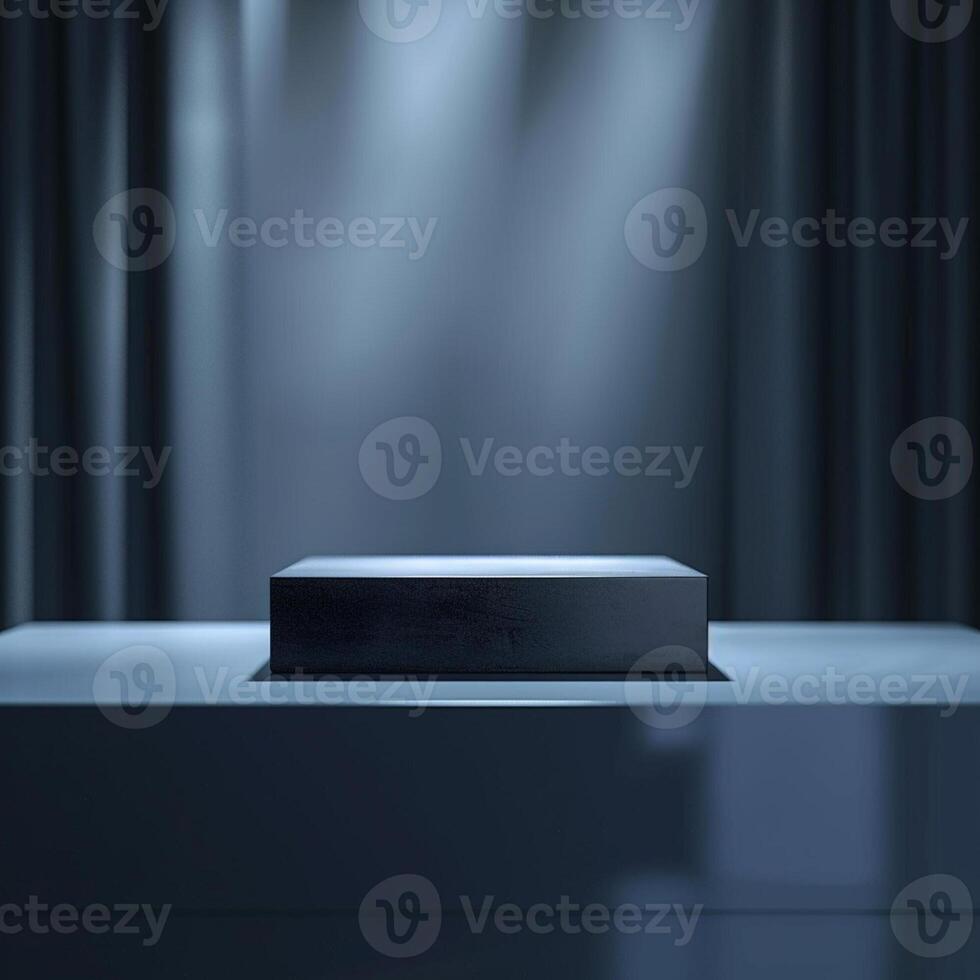A black box on a table in front of a spotlight photo