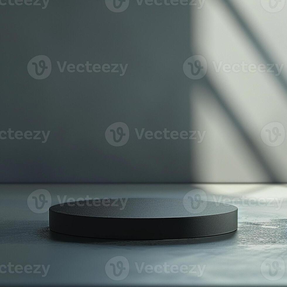 A black round table on a table in front of a wall photo