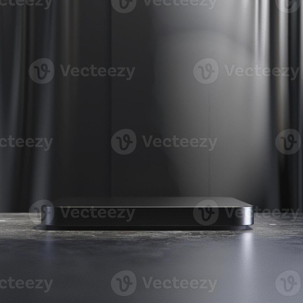 Black tv on a table in front of a black curtain photo