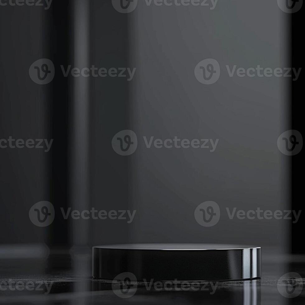A black object sitting on a table in front of a black background photo