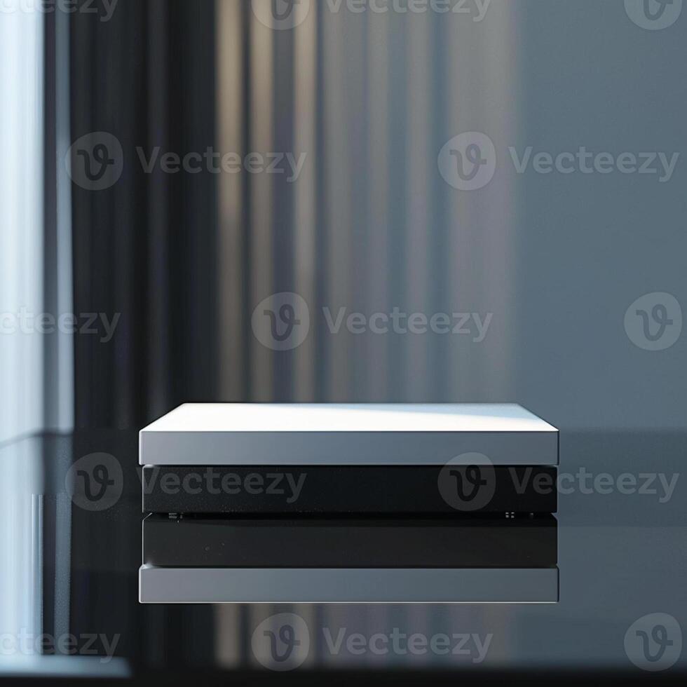 A white box sitting on a table in front of a window photo