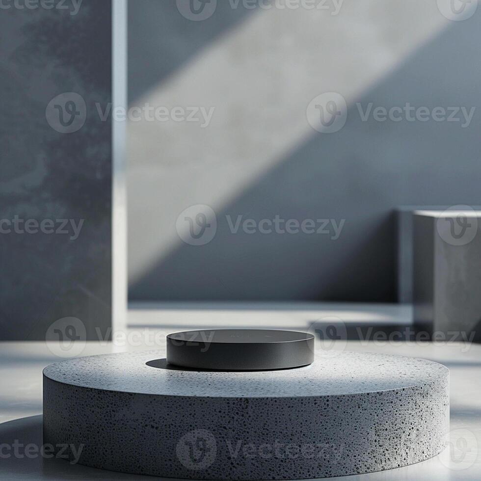 A black object sitting on a concrete pedestal photo