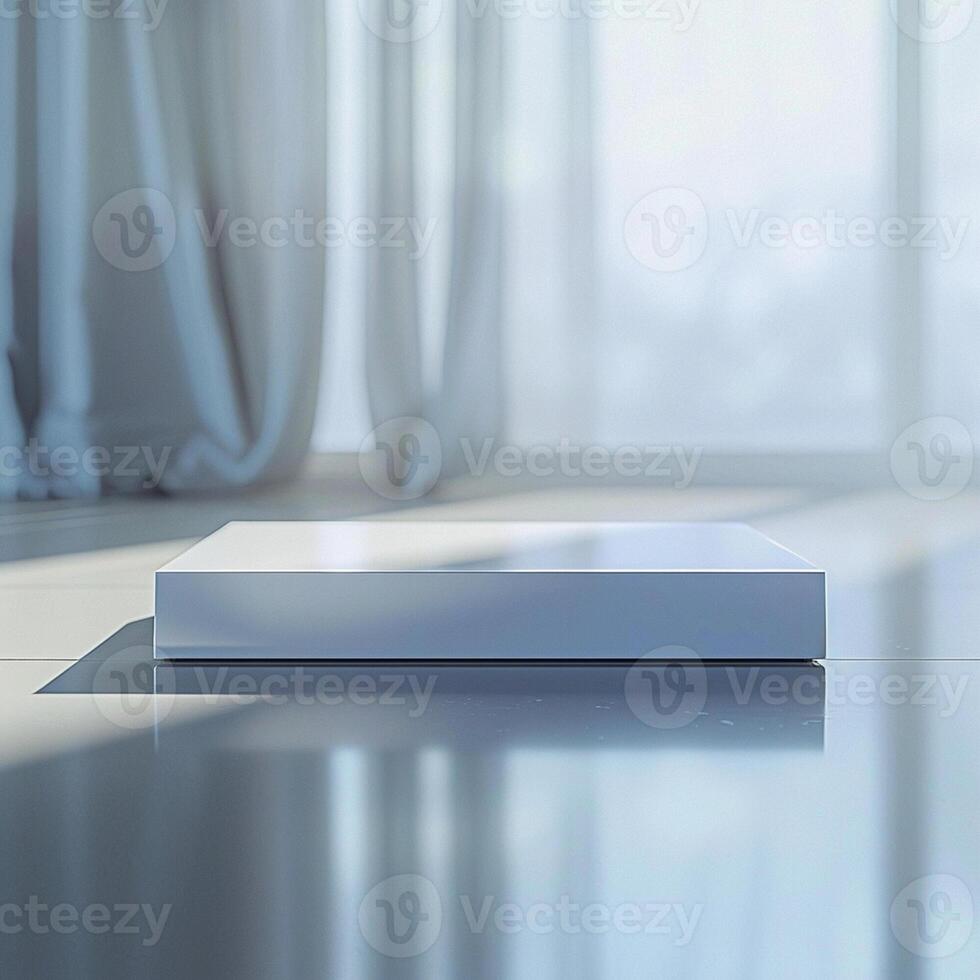 A white box sitting on a table in front of a window photo