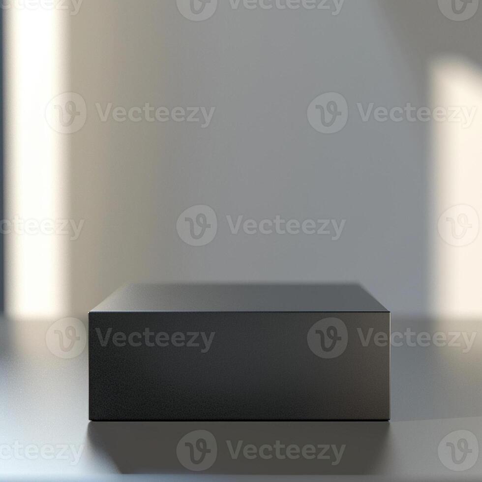 A black box sitting on a table in front of a wall photo