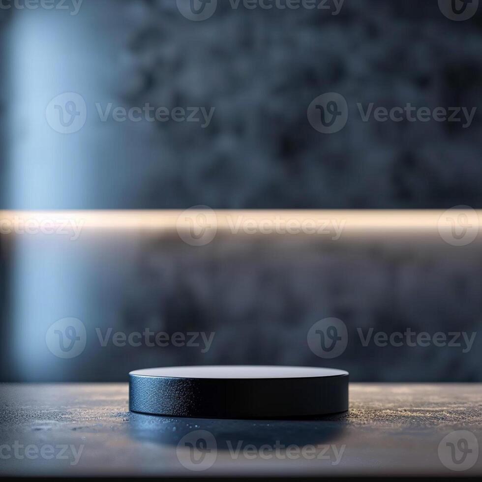 A black object sitting on a table in front of a wall photo