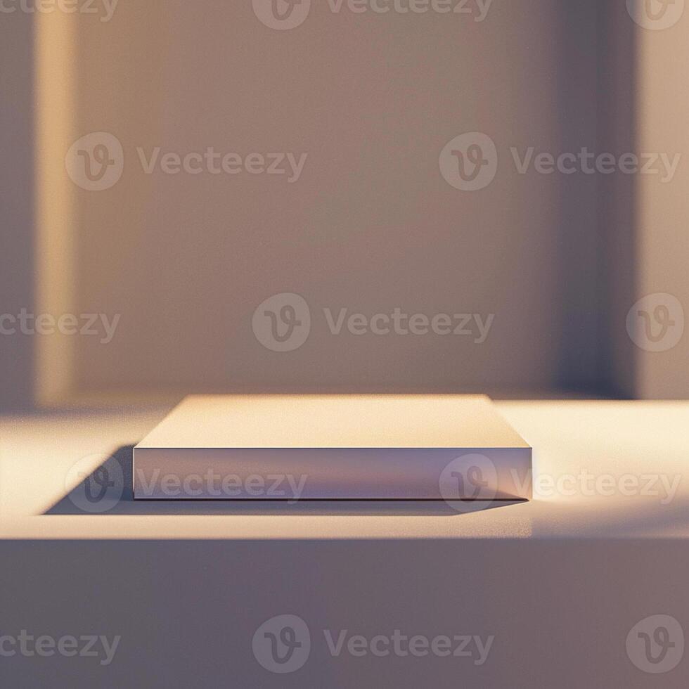A white book sitting on a table in front of a window photo