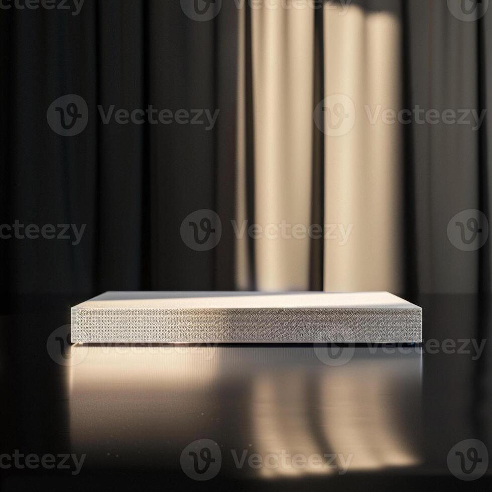 A white box sitting on a table in front of a curtain photo