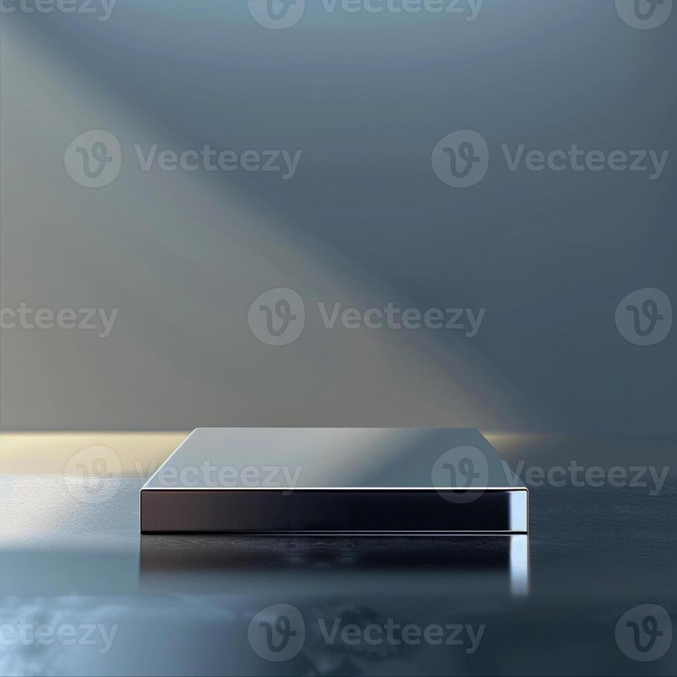 A silver box sitting on a table with a light shining on it photo