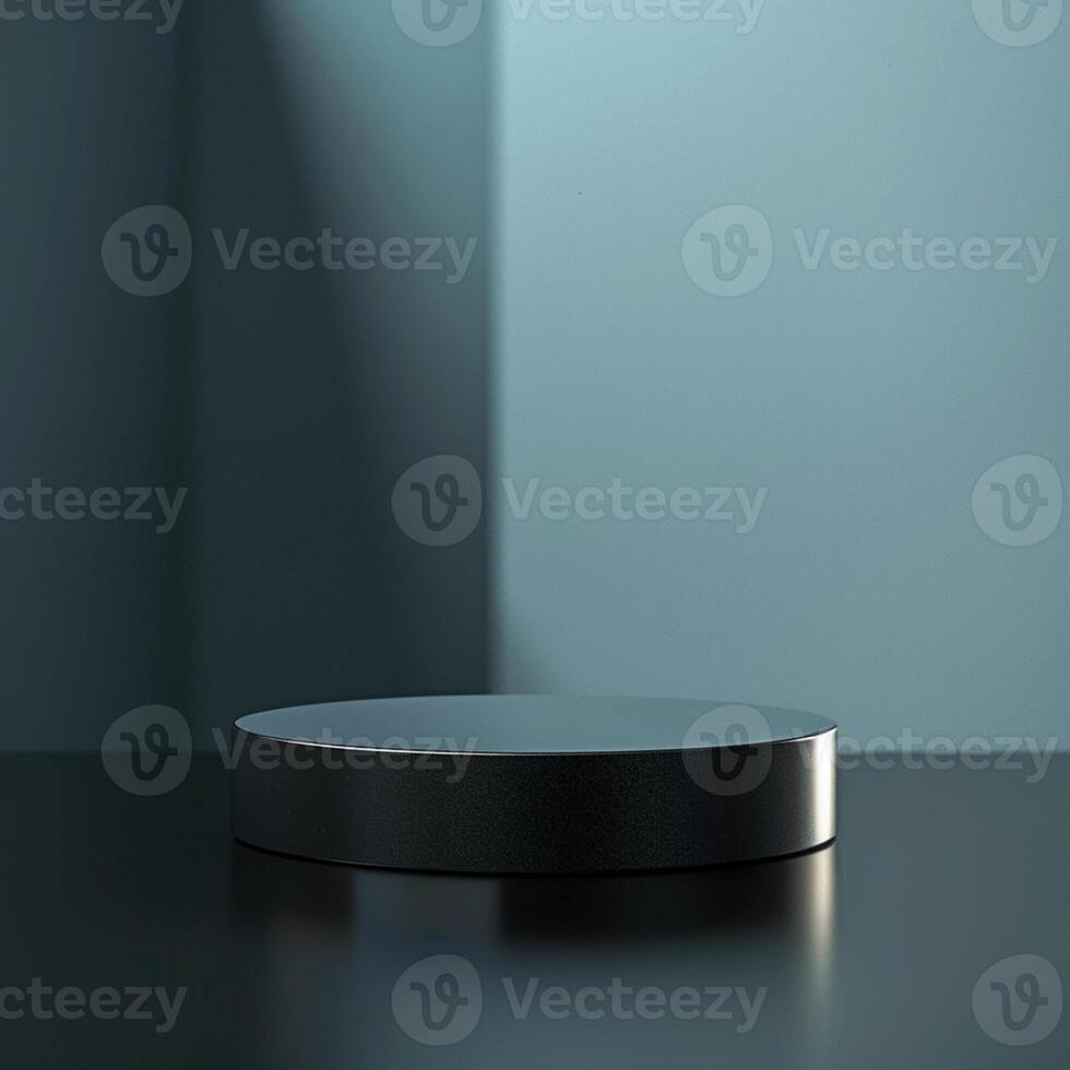 A black round table on a table in front of a wall photo