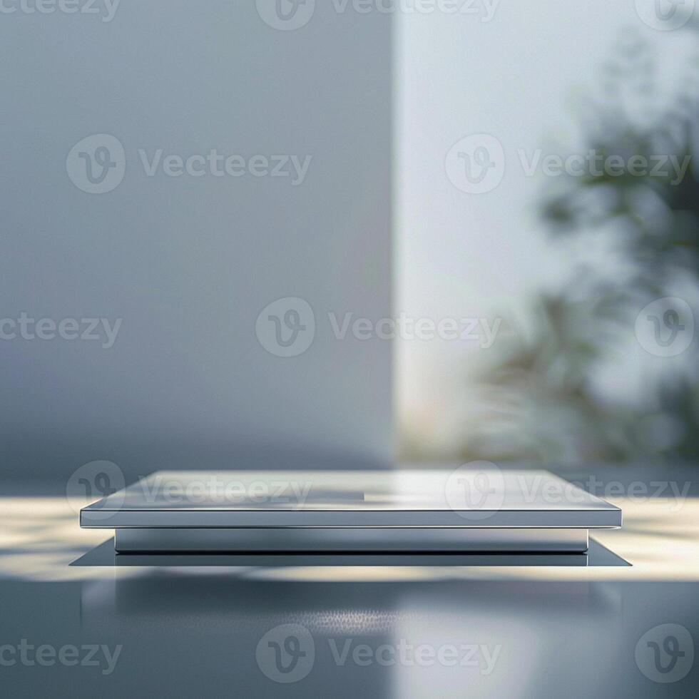 A white laptop sitting on a table in front of a window photo