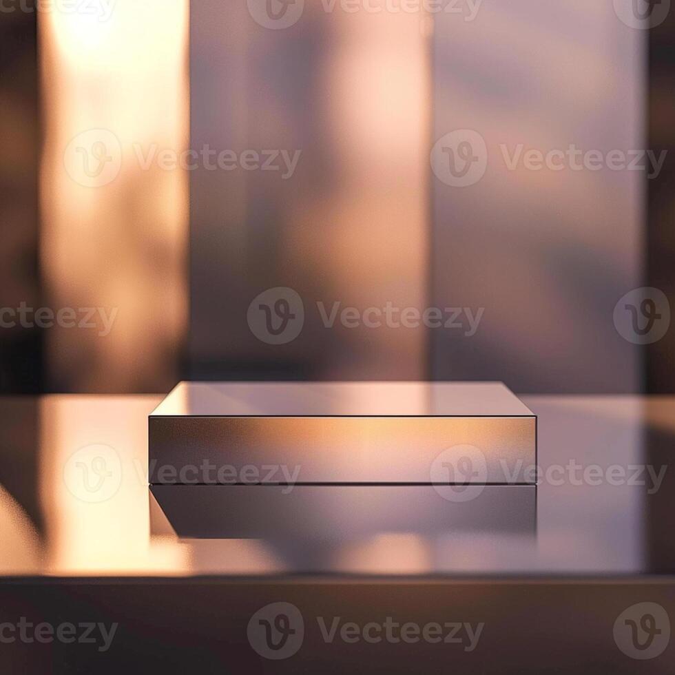 A silver box sitting on a table in front of a window photo