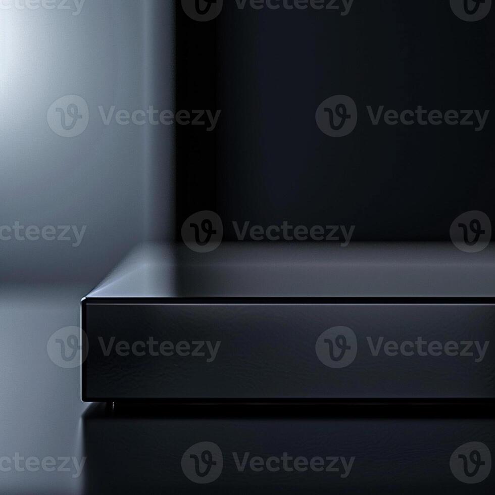 A black box with a silver top on a table photo