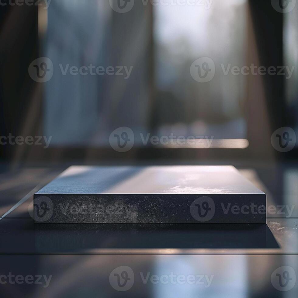 A white box sitting on a table in front of a window photo