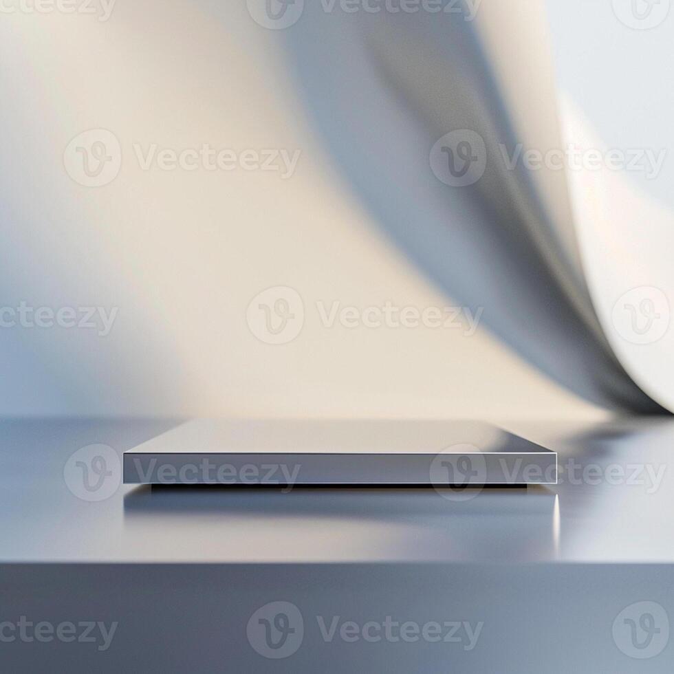 A white box sitting on a table in front of a wall photo